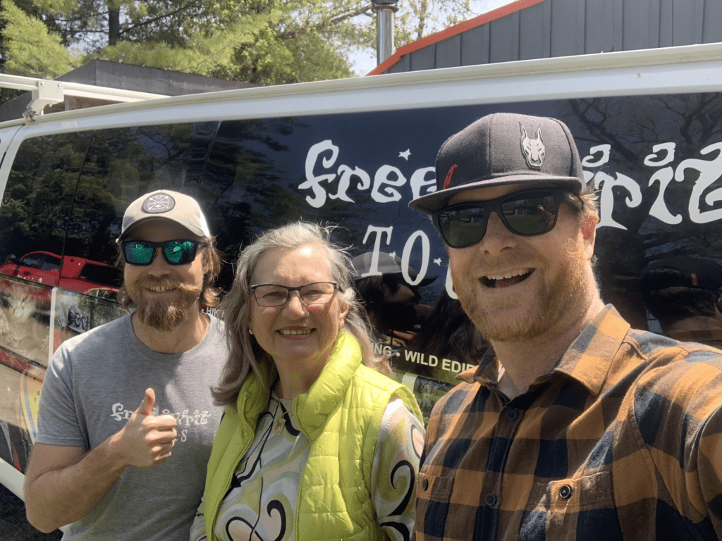 Heathcote Three people smiling in front of Free Spirit Tours van