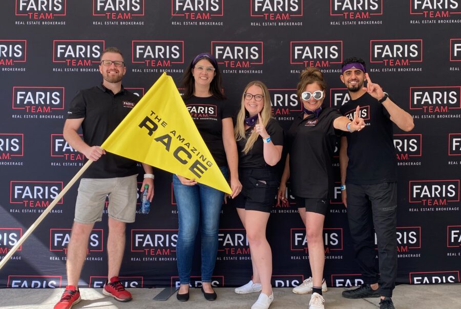 Group of people in front of branded background