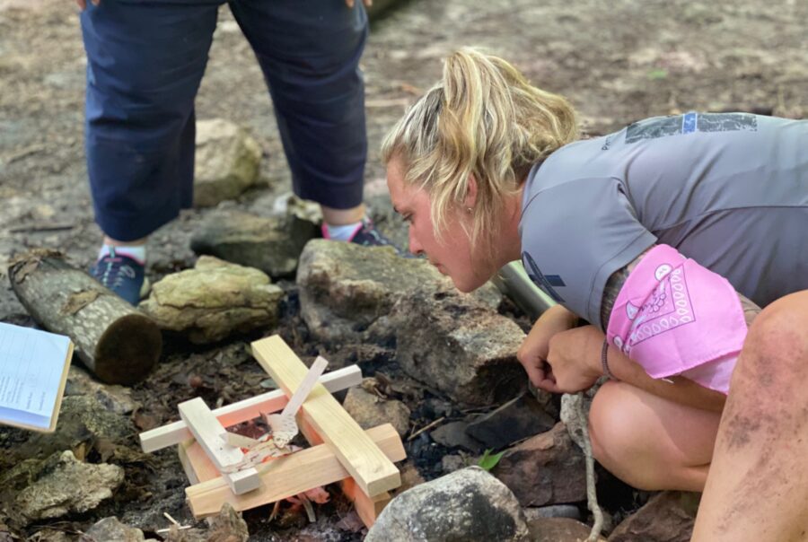 Woman building a fire