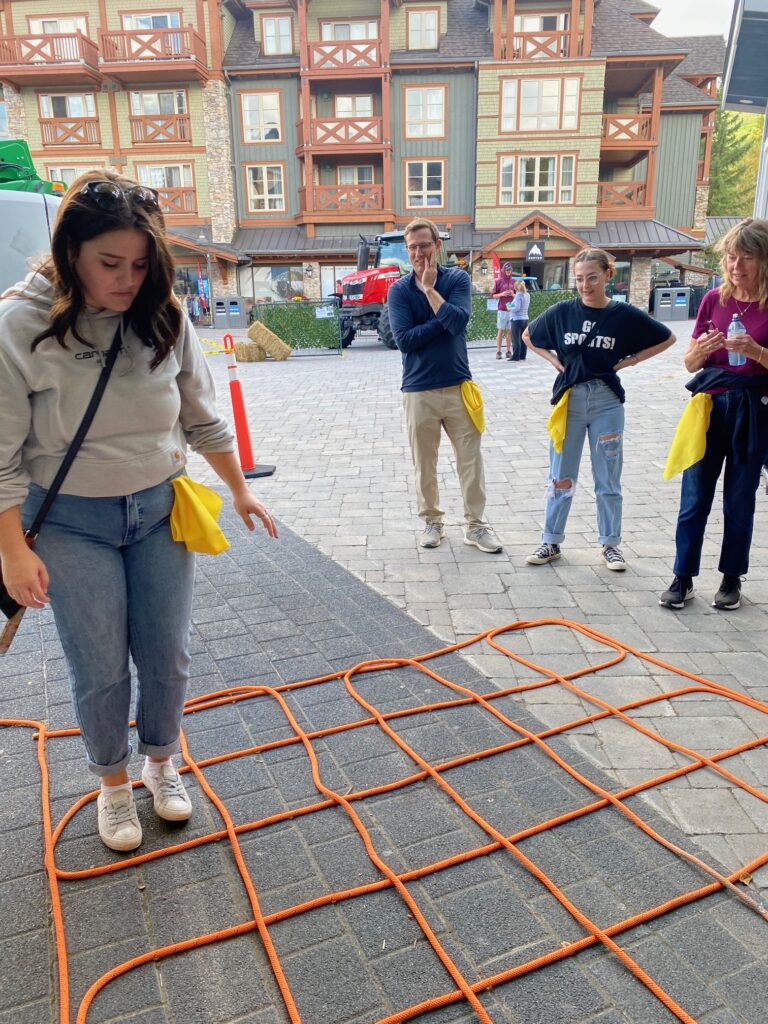 IMG_6973 Woman standing in one square of a grid made from rope